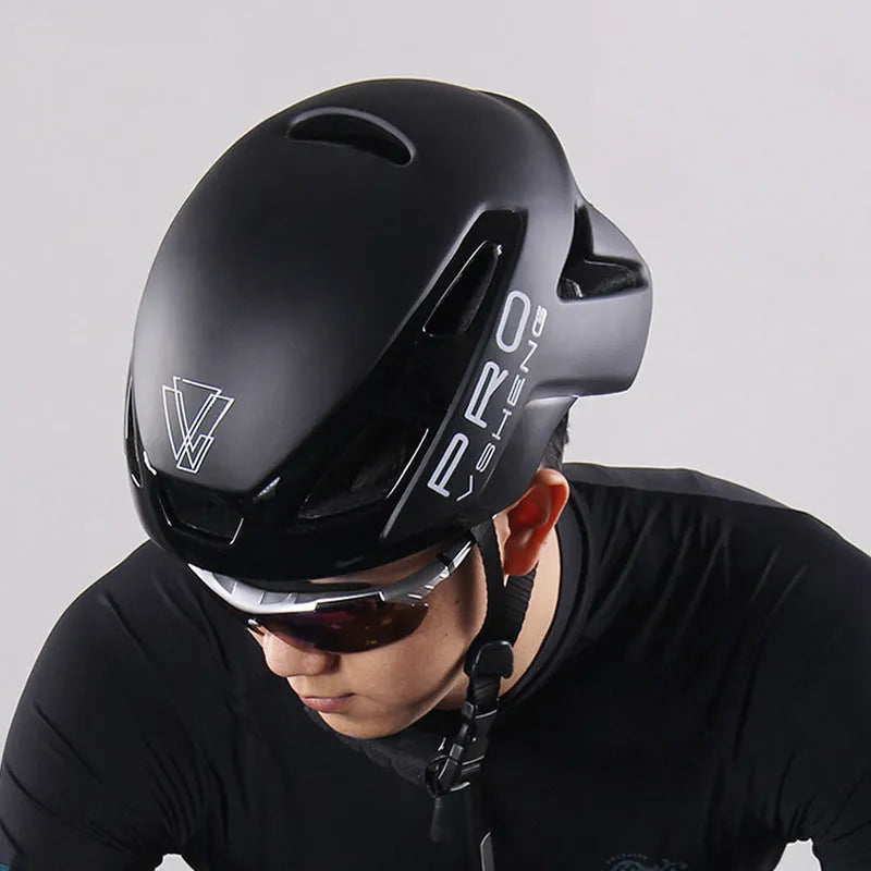 Road bicycle safety helmet in black with visible vents and adjustable buckle