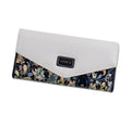 A women's large capacity three-fold PU leather wallet with a buckle, shown in one of five colours.