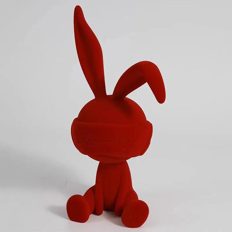 Suede blindfold rabbit resin table ornament in blue, green, or red colour.