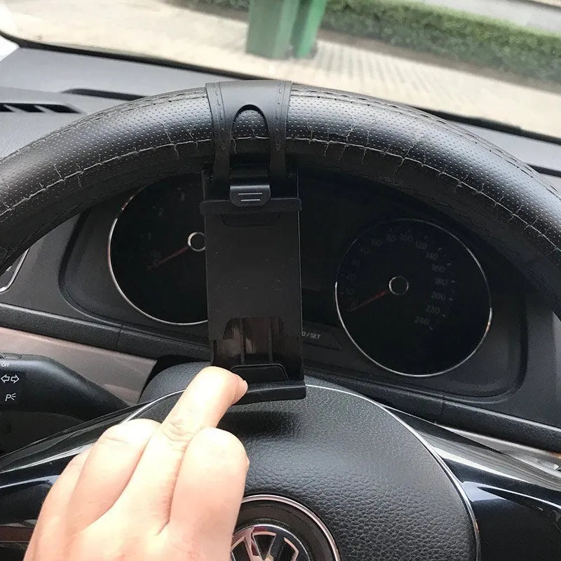 Universal black steering wheel phone holder mount clipped onto a car steering wheel.
