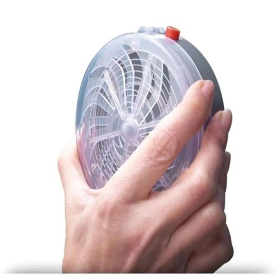 Solar bug zapper for mosquitoes and insects, white and black design on a table in a garden