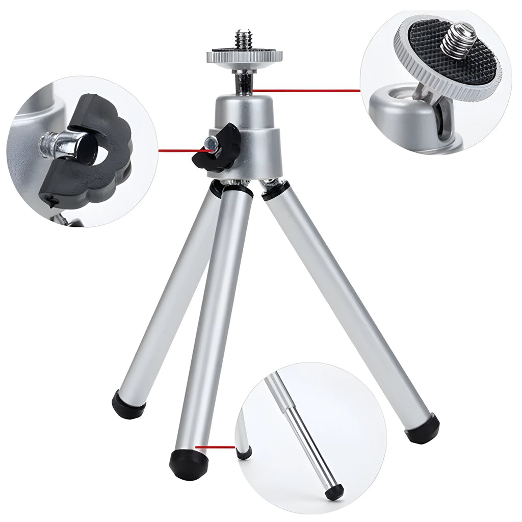 Mini aluminium tripod extended with ball head, shown alongside a U-shaped smartphone clip on a table.