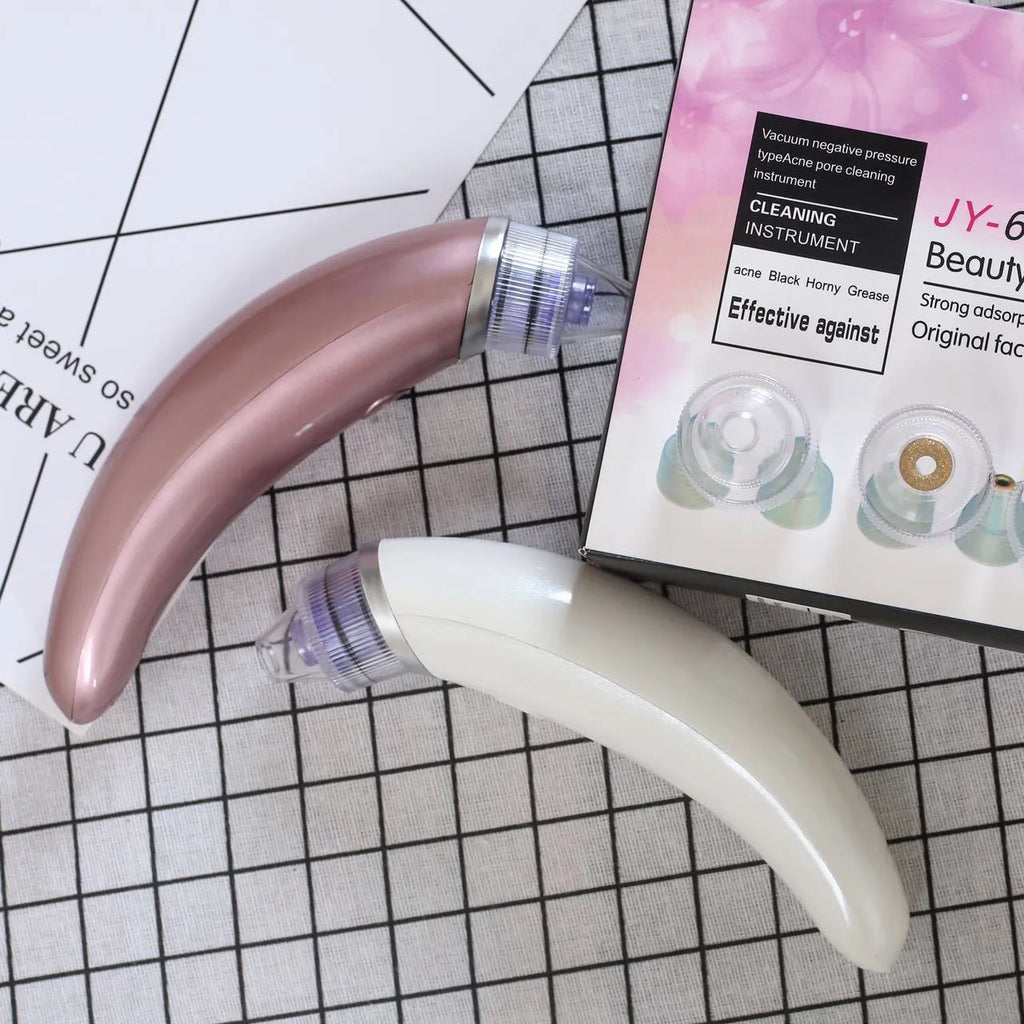 JY-666 electric blackhead suction instrument in rose gold and white colours for facial cleansing