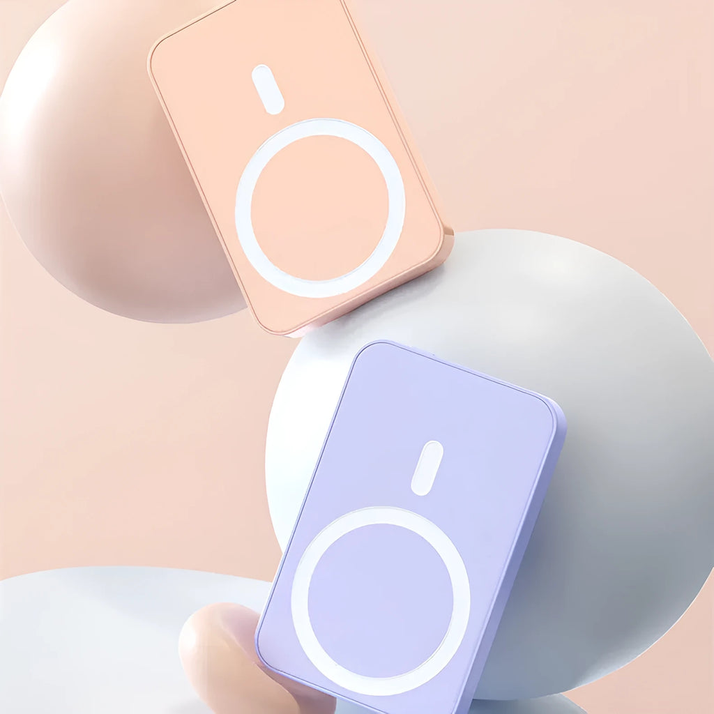Pink plastic wireless magnetic power bank showing dimensions of 100mm by 64mm.