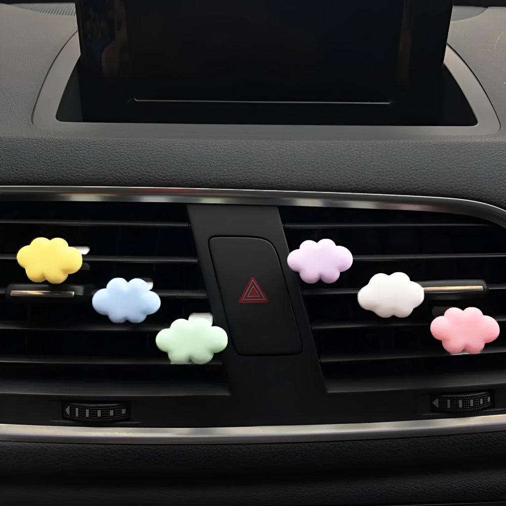 Resin Baiyun cartoon car air freshener clip in pastel colours on a car vent.