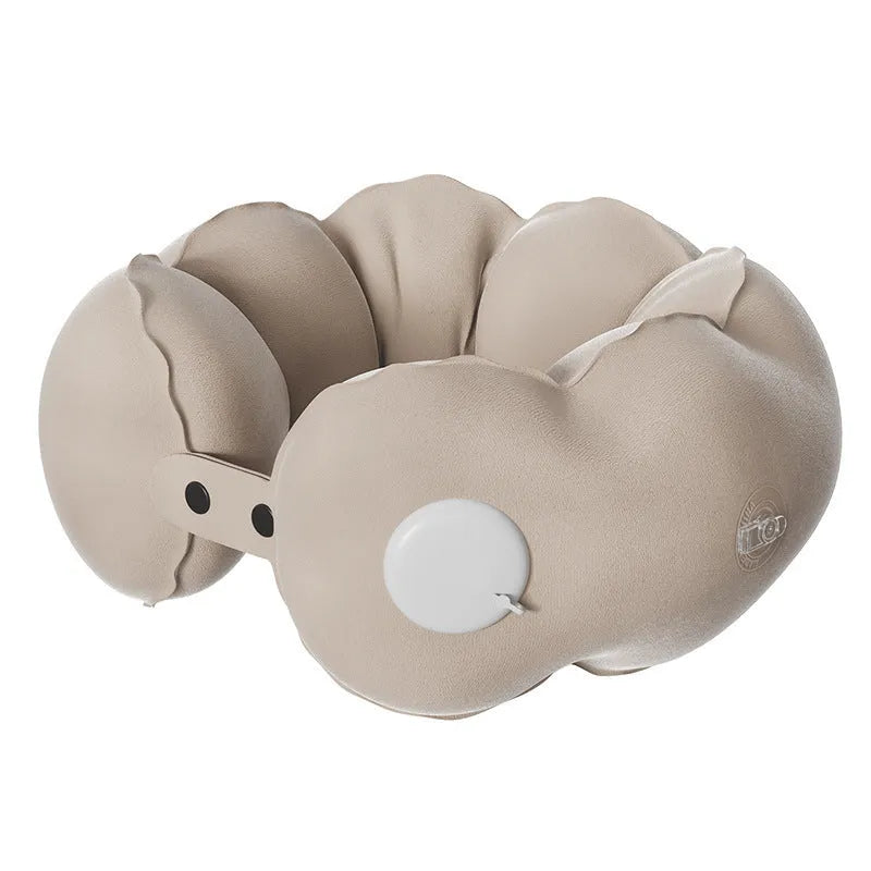 Inflatable U-shaped travel neck pillow in cloud bubble colour, shown deflated and packed.