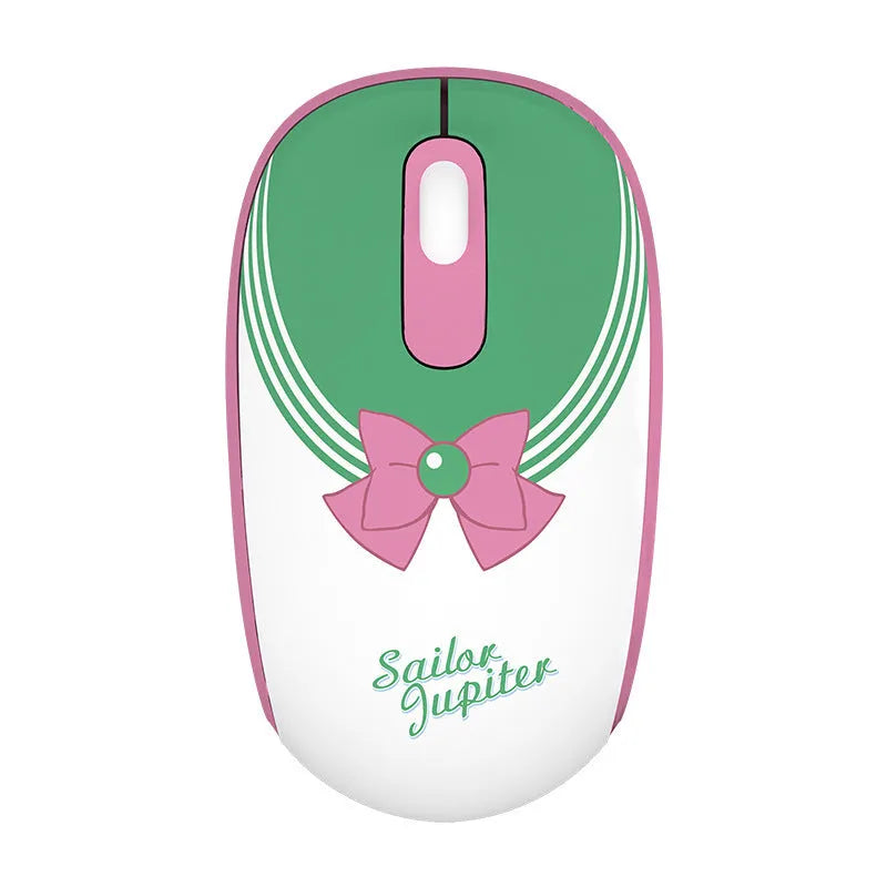 Pink Sailor Moon cartoon wireless mouse with USB receiver on a desk.