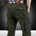 Men's straight leg casual trousers in khaki with multiple pockets, side view on a white background