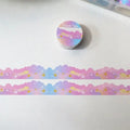 Roll of stars and clouds border pattern washi tape on a white background, showing 24mm width.