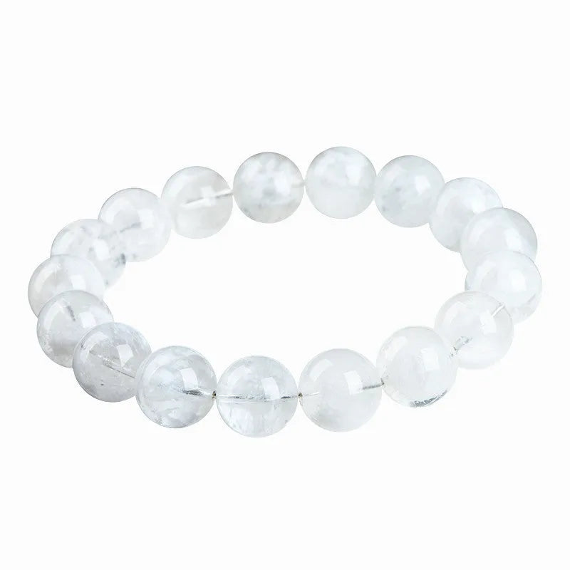 Women's bracelet with round blizzard snowflake crystal beads in geometric shapes on a wrist.