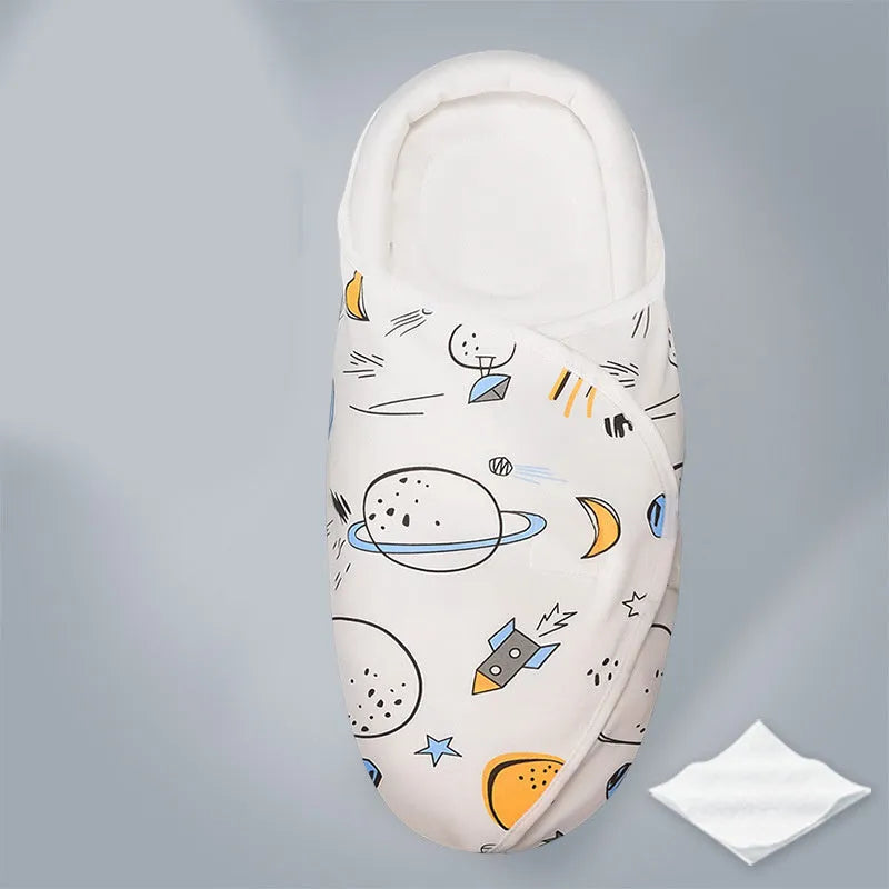 Cotton baby anti startle swaddle measuring 30 by 60 centimetres in a colourful print design.