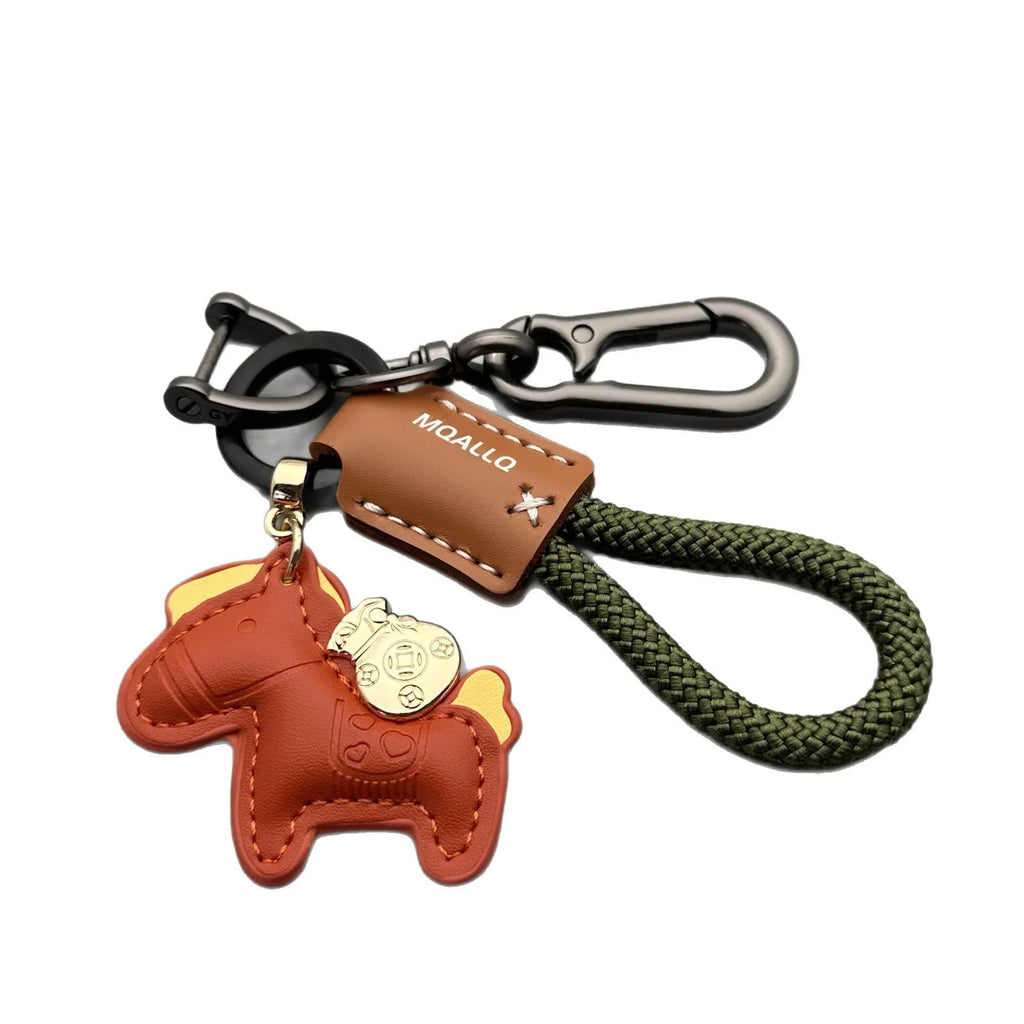 Handmade cowhide key ring pendant with a detailed zinc alloy pony buckle and coloured flannelette rope.