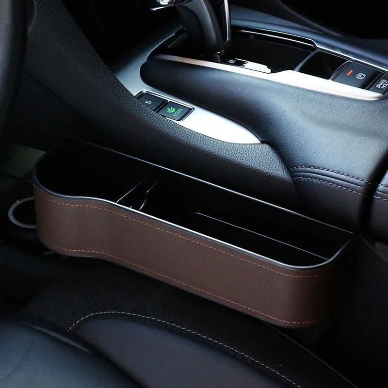 PU leather car seat gap storage box in black holding a smartphone and wallet between the console and seat