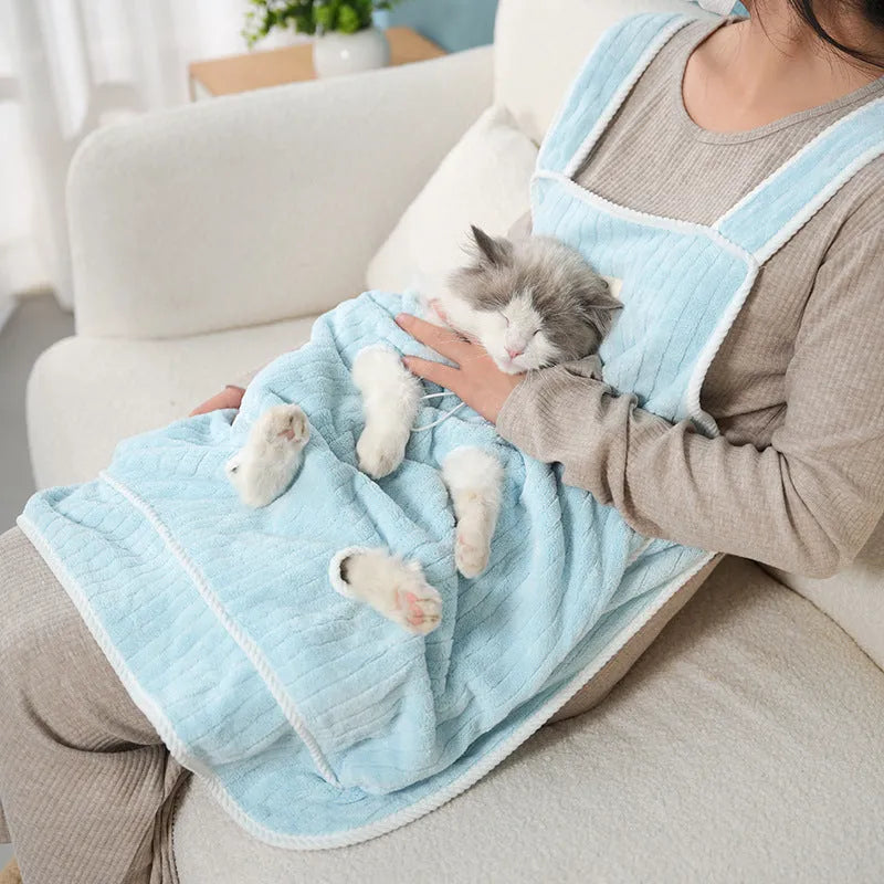 Cloth cat petting apron in a striped pattern, shown worn by a person holding a cat.