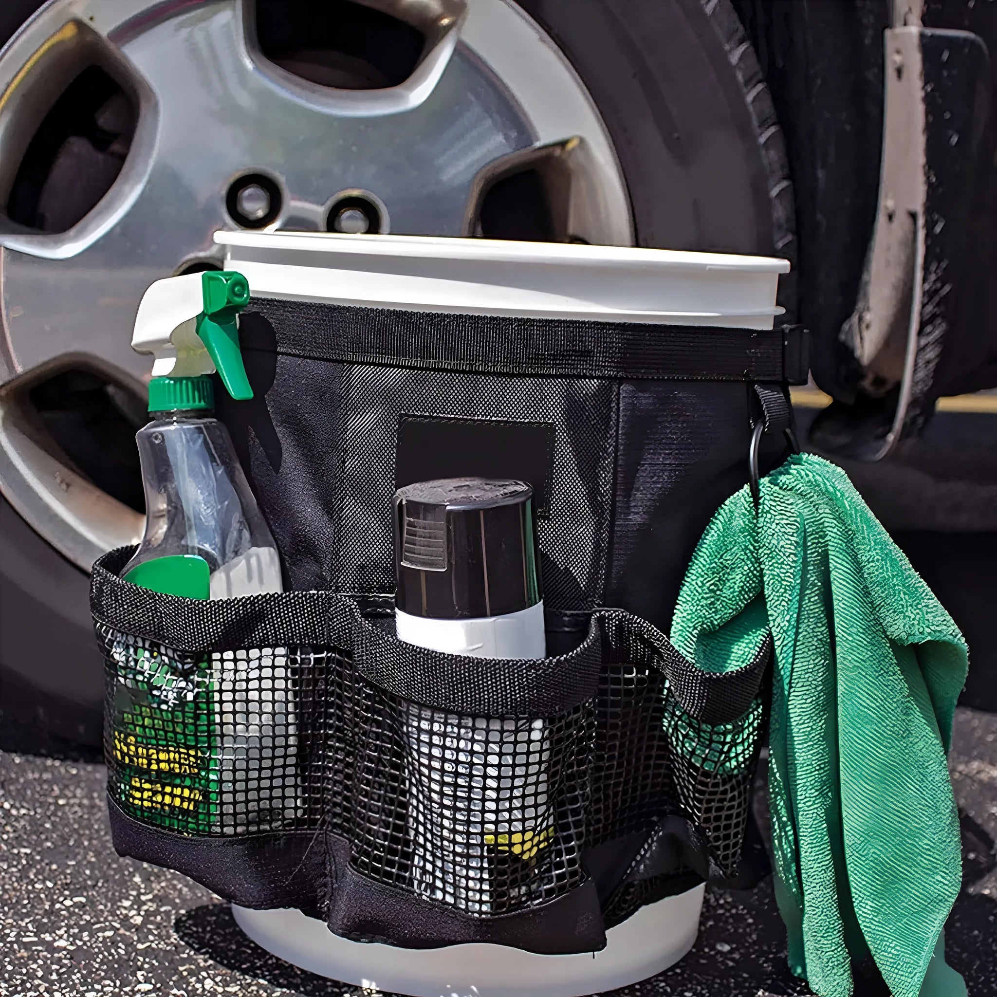 Black cylindrical polyester hanging storage bag attached to a 5-gallon barrel.