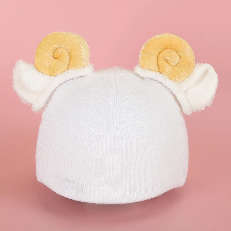 Soft plush cartoon character cover stretched over a pair of black on-ear headphones.