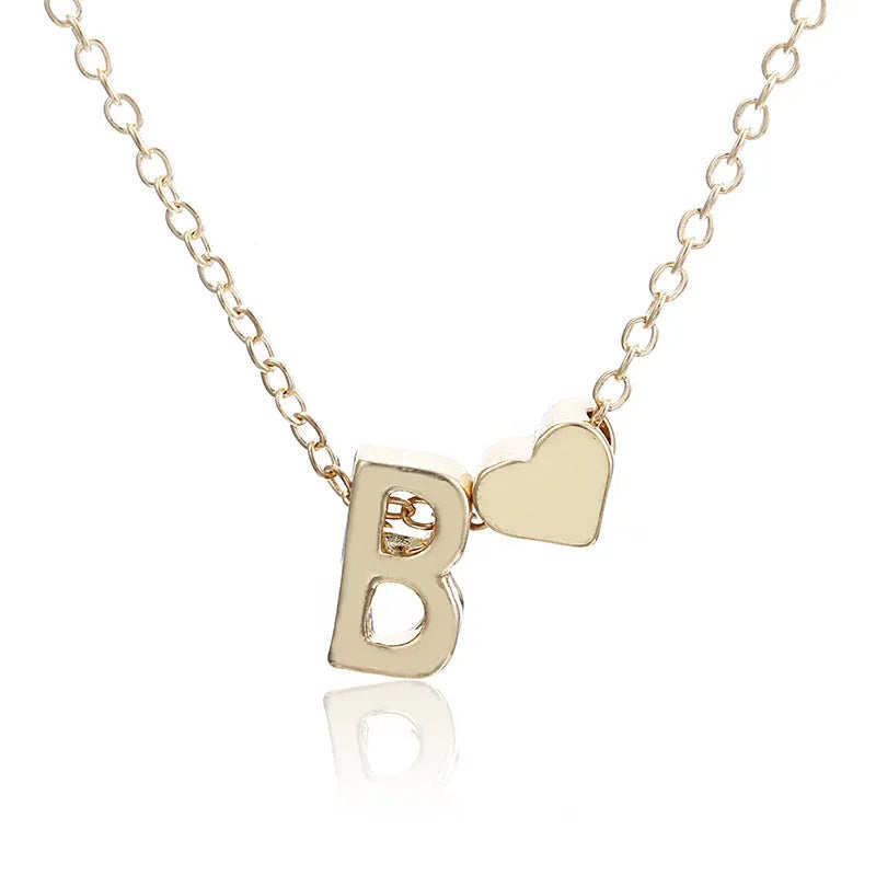 Peach heart shaped letter necklace pendant in gold and silver alloy finishes