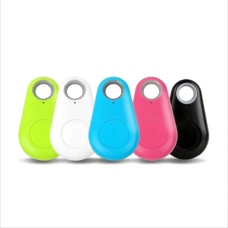 Small Bluetooth tracker in black with keyring hole, 3.1cm x 5.2cm, paired with smartphone