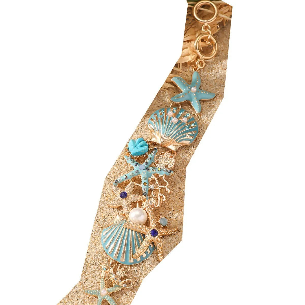 Women's alloy nautical bracelet with boat anchor, shell, and starfish charms in turquoise, red, or blue.