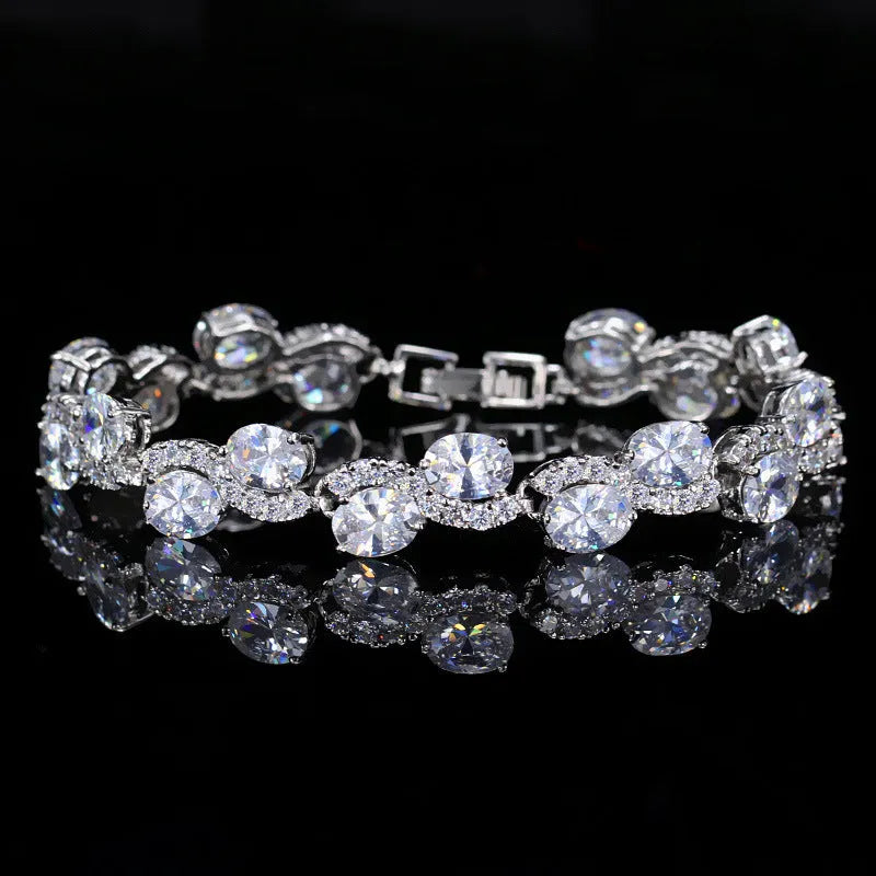 Copper gold electroplated bracelet with AAA+ zircon stones in geometric design measuring 18.4 cm length