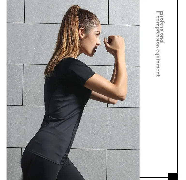 Women's black compression short-sleeved top with stretch fabric, XS size, front view