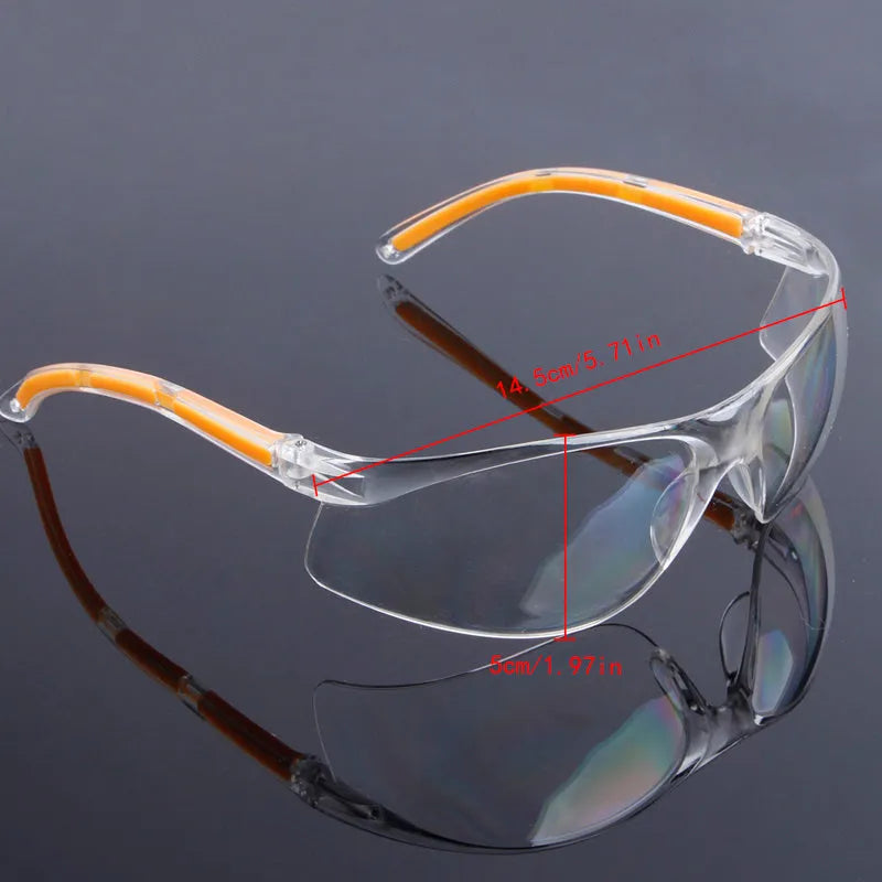 Transparent polycarbonate safety goggles with yellow tinted lenses for eye protection.
