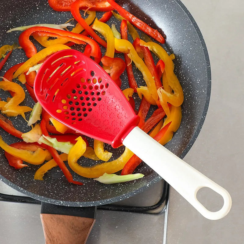 Red and black plastic multifunctional cooking spoon with grinding serrations and half-enclosed design