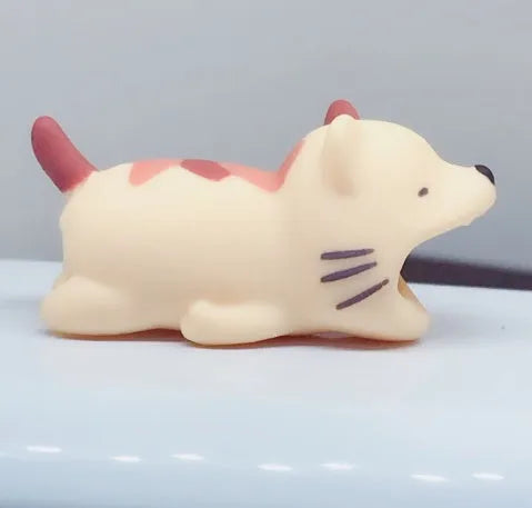iPhone Lightning cable protector in an animal design, shown on the end of a charging cable.
