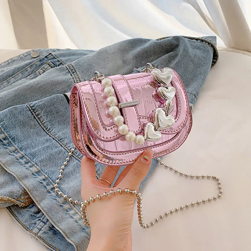 Silver women's PU leather mini saddle crossbody bag with square shape and single shoulder strap.