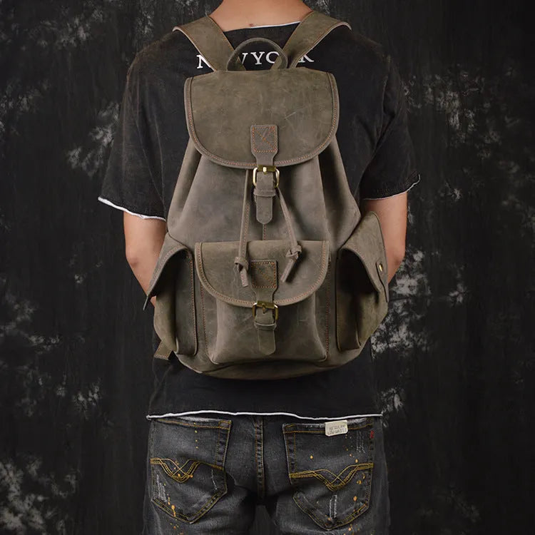 Men's leather drawstring backpack in first layer cowhide, retro style, 30cm x 15cm x 40cm, with curved shoulder strap and soft handle.