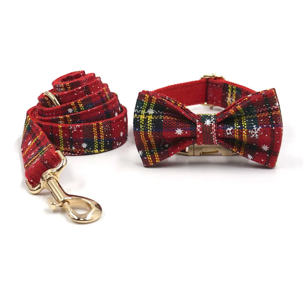 Red cloth Christmas dog collar and lead set with matching chest strap, bow, and waste bag.