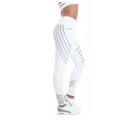 Women's black workout leggings with glowing white print pattern, showing slimming pencil pants fit.