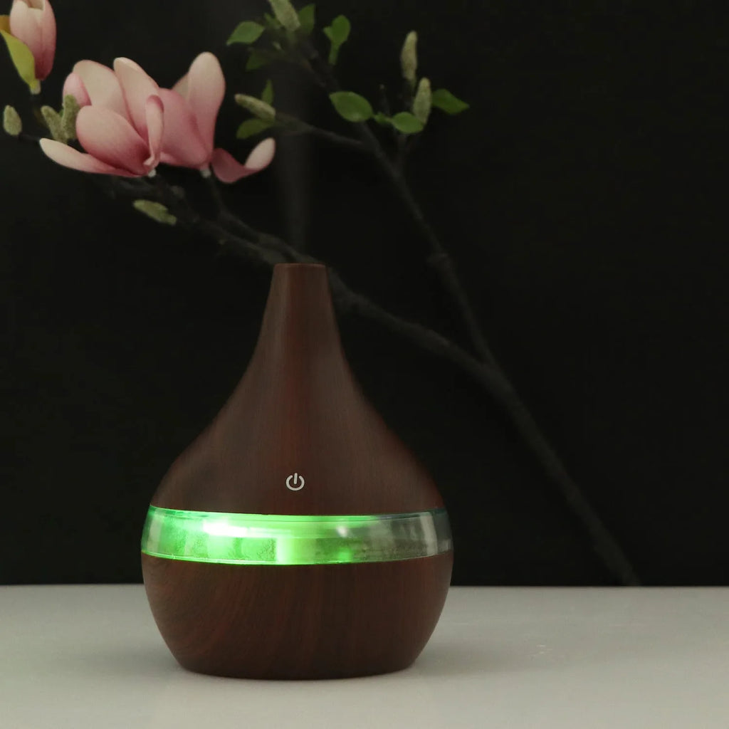 USB mini air purifier humidifier with wood grain finish in columnar shape for small rooms.