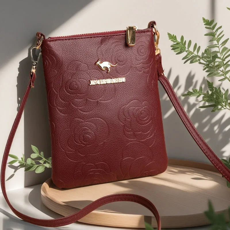 Soft black PU leather square vertical shoulder messenger bag with an external front pocket.