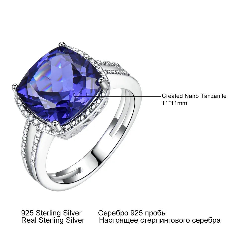 Women's sterling silver ring with a blue tanzanite gemstone on a silver band.