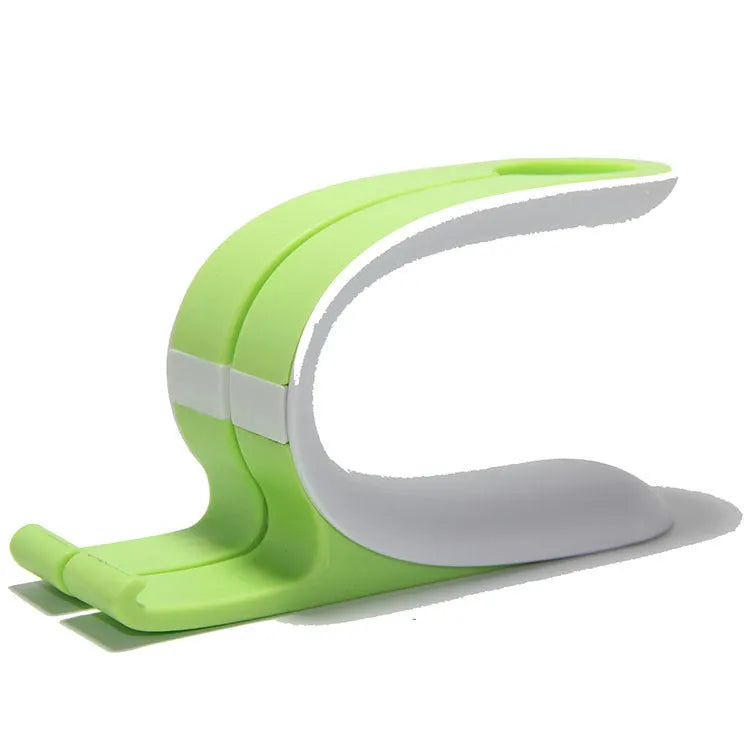 Grey Apple Watch and iPhone charging stand on desktop