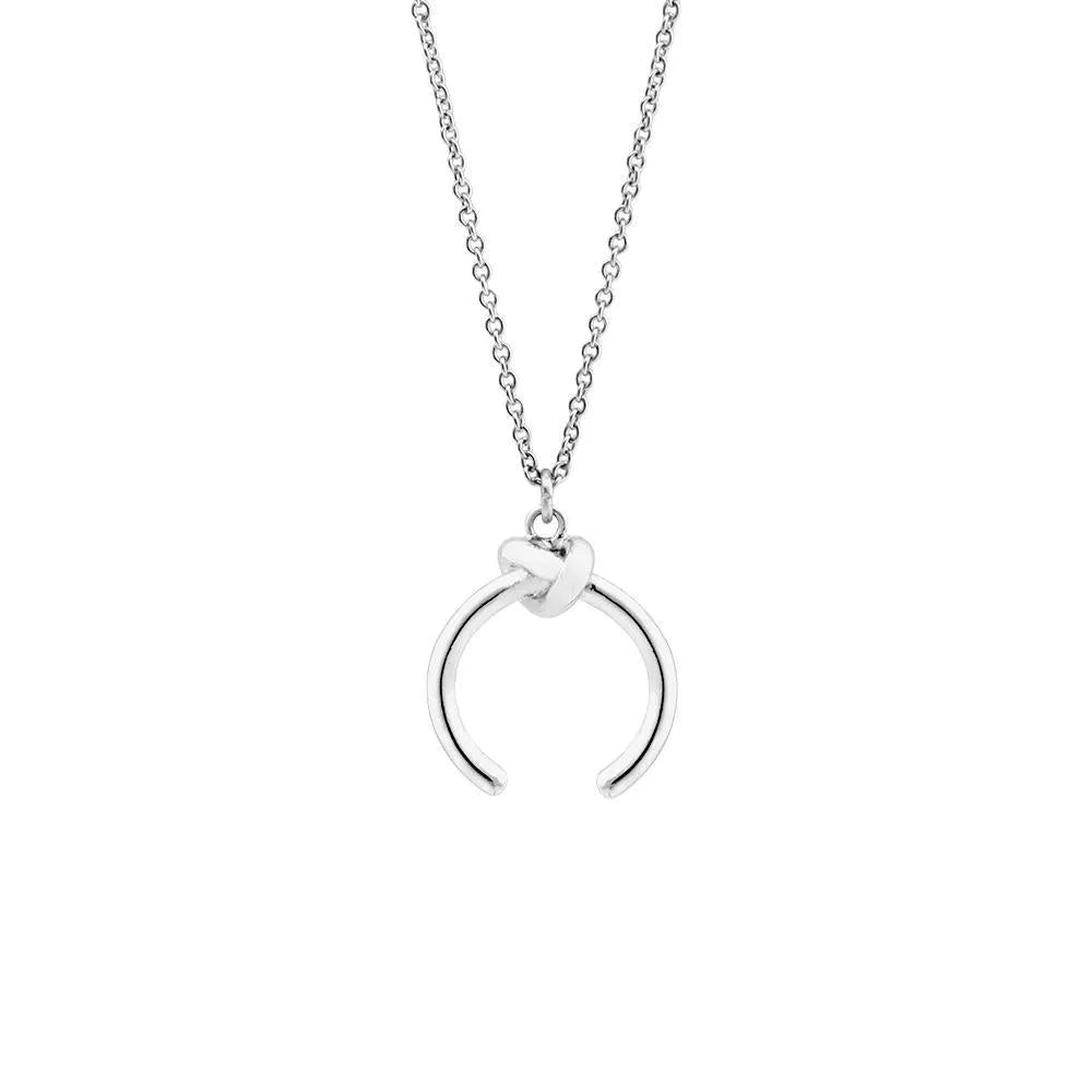 A vintage-style geometric pendant necklace with a cross chain, shown in gold and silver finishes.