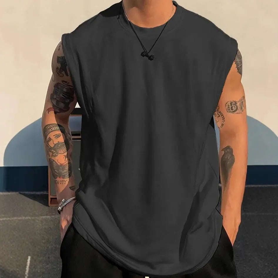 Men's loose fit cotton tank top in solid colours showing sleeveless design and straight hem