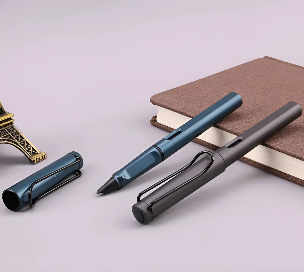 Black and blue frosted ink bag fountain pen with 0.5mm and 0.38mm stainless steel nib options on a notebook.
