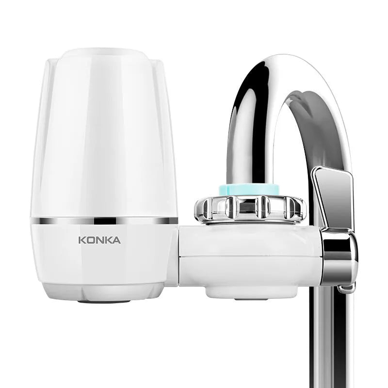 White kitchen faucet water filter with ceramic cartridge and universal thread adapters for tap mounting.