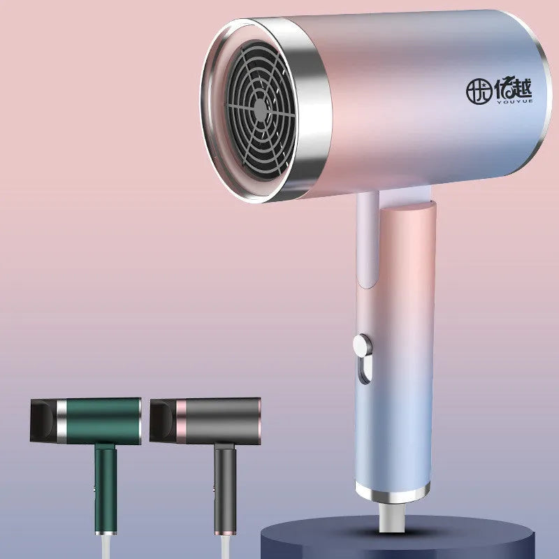 Foldable household hair dryer in emerald green with negative ion technology and four speed settings