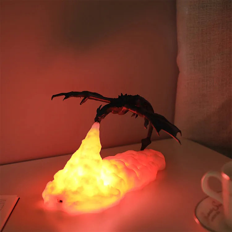 3D printed red dragon night light glowing on a bedside table