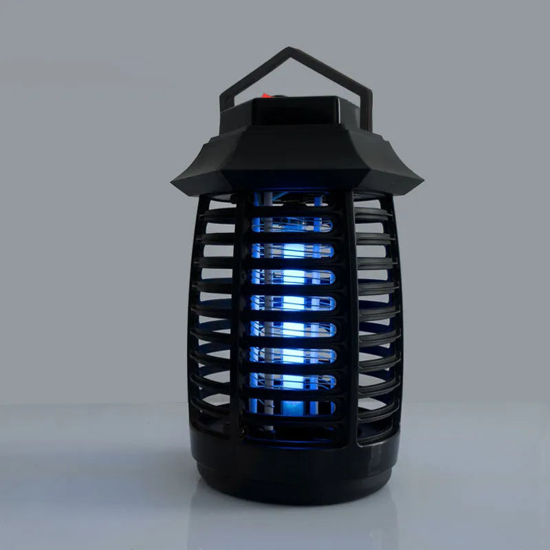 Black aromatherapy mosquito lamp with a UV glass tube and protective metal grid for indoor insect control.