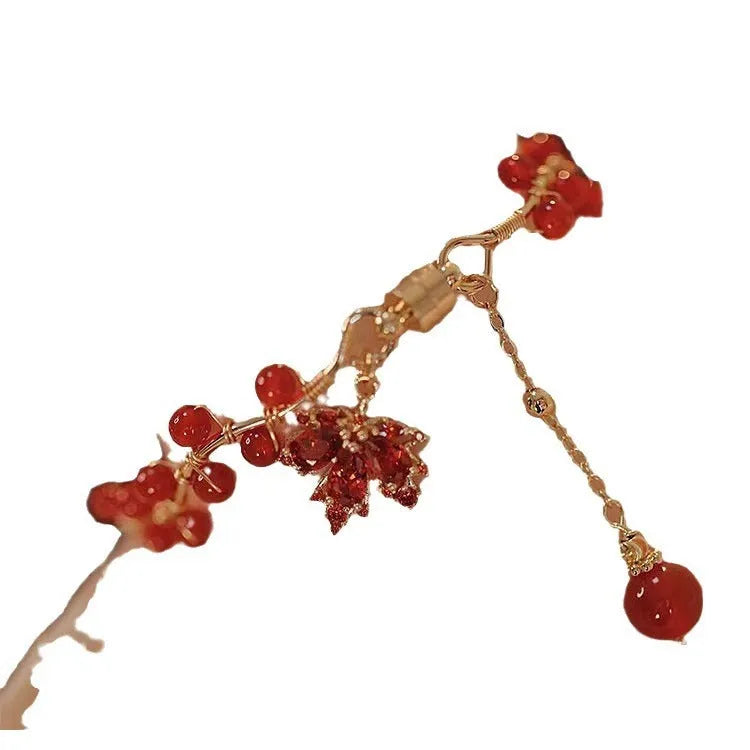 Red ginkgo leaf charm on an alloy magnetic bracelet in a Chinese style.