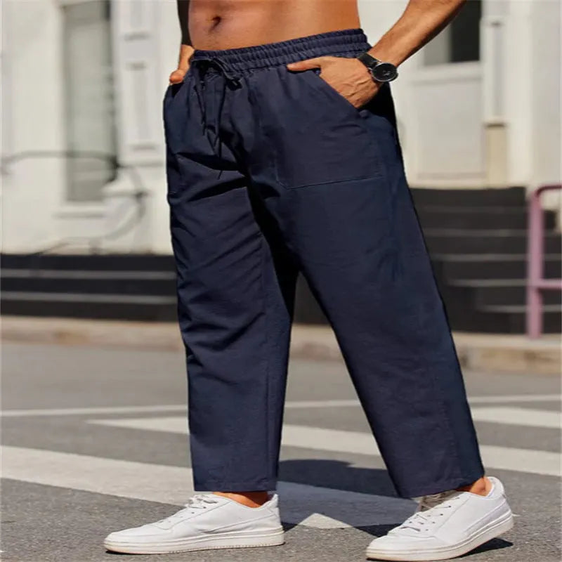 Men's straight-leg linen casual trousers in apricot colour with an elastic waistband.