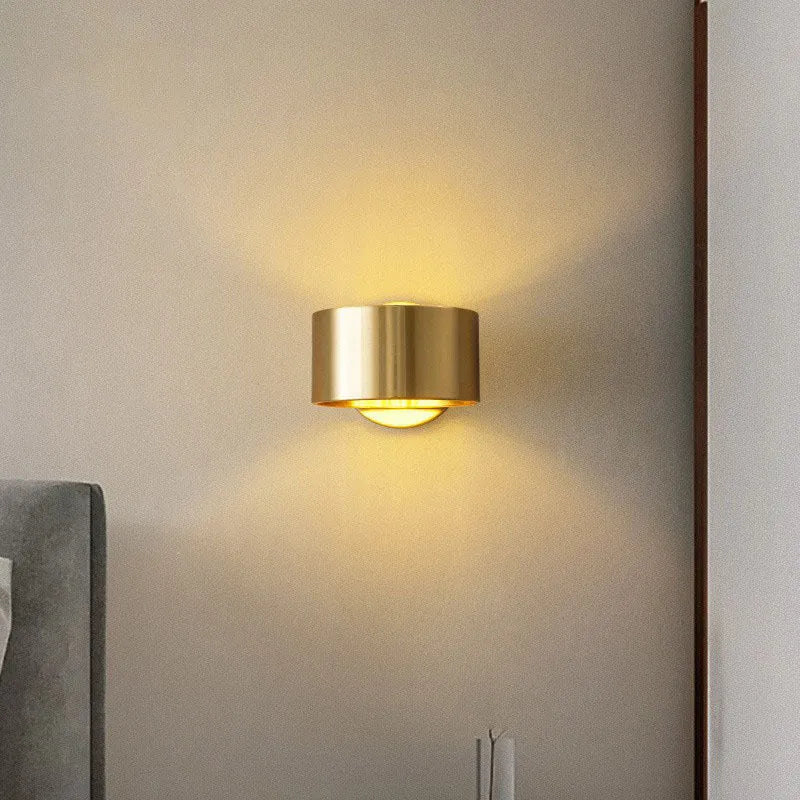 Modern simple style copper wall lamp in black or gold finish with plug.