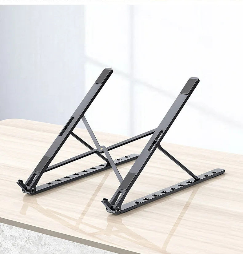 Foldable aluminium laptop stand in silver with silicone pads and cable management slot for 7-15 inch laptops