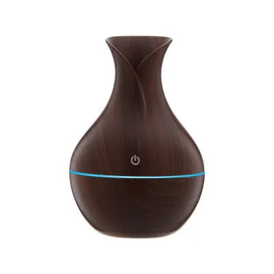 Small vase humidifier with 130ml water tank in Crackle Mahogany finish, USB powered, on a wooden desk