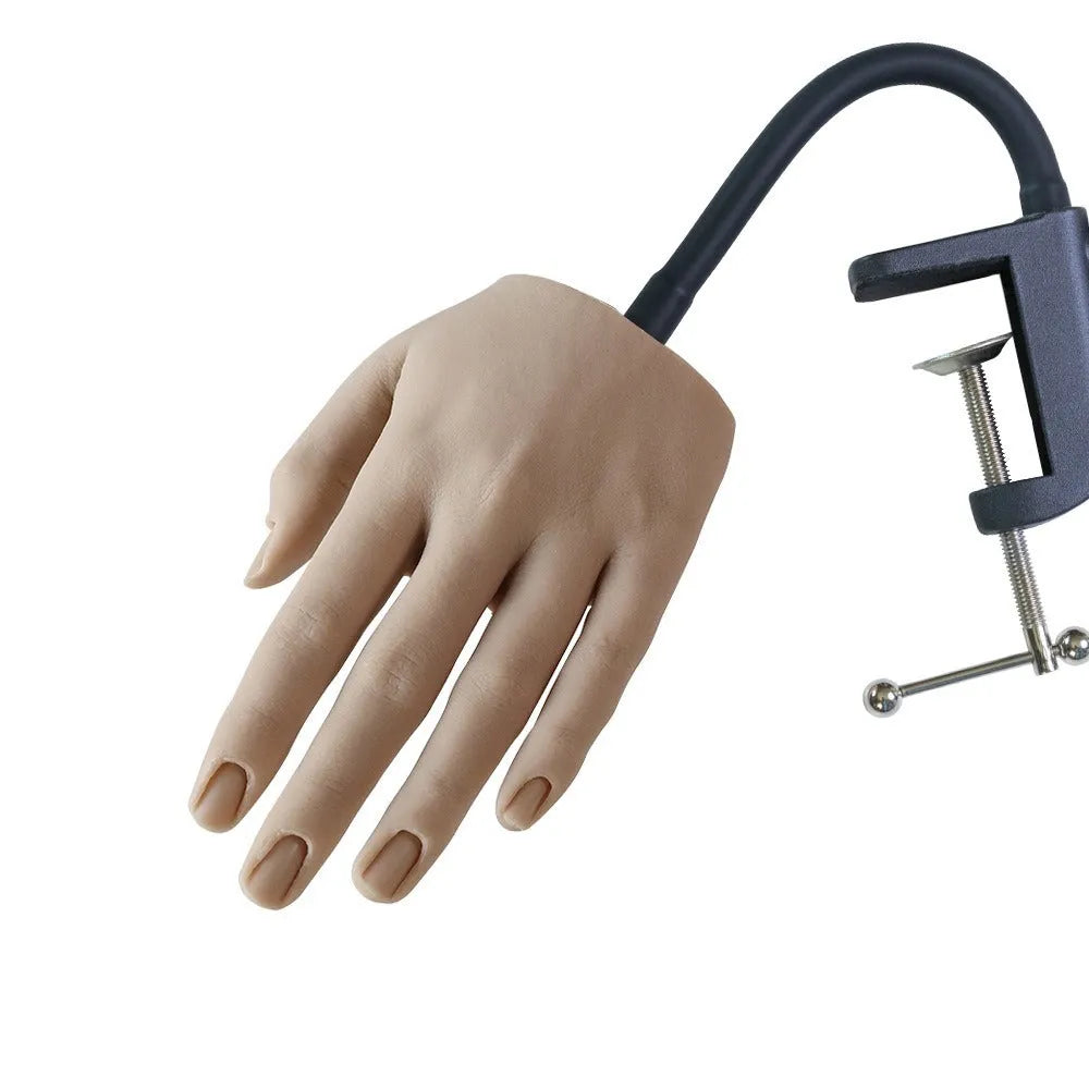 Silicone nail practice hand model with coloured nail tips on fingers for manicurist training.