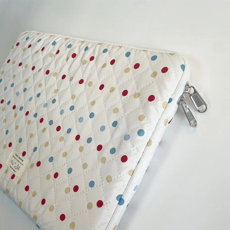 Polka dot patterned laptop bag for women, shown in available sizes for 11-inch to 15.6-inch laptops.